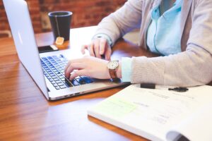 Female student working alone at a laptop